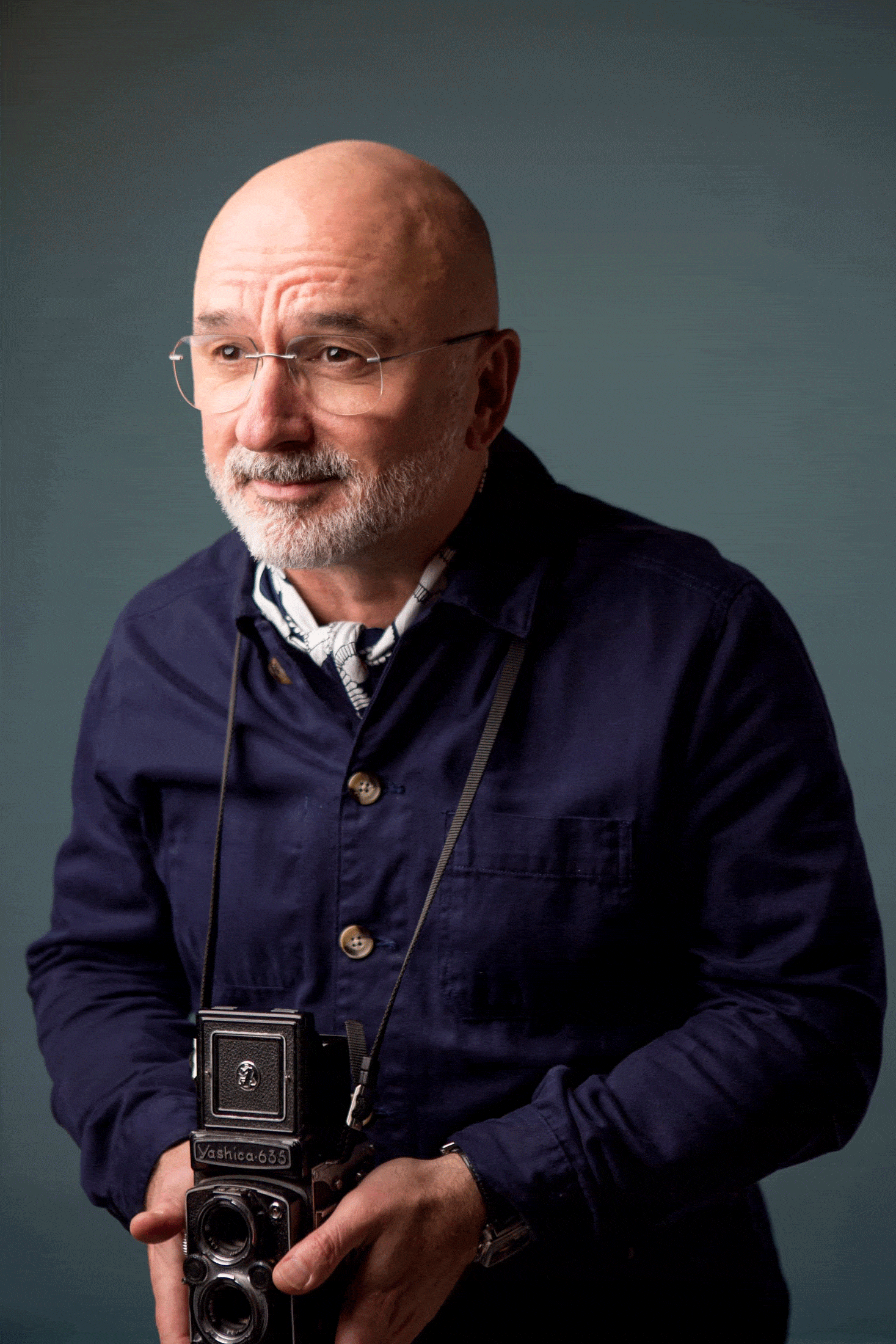 Simon Isaac gif holding a camera and pointing