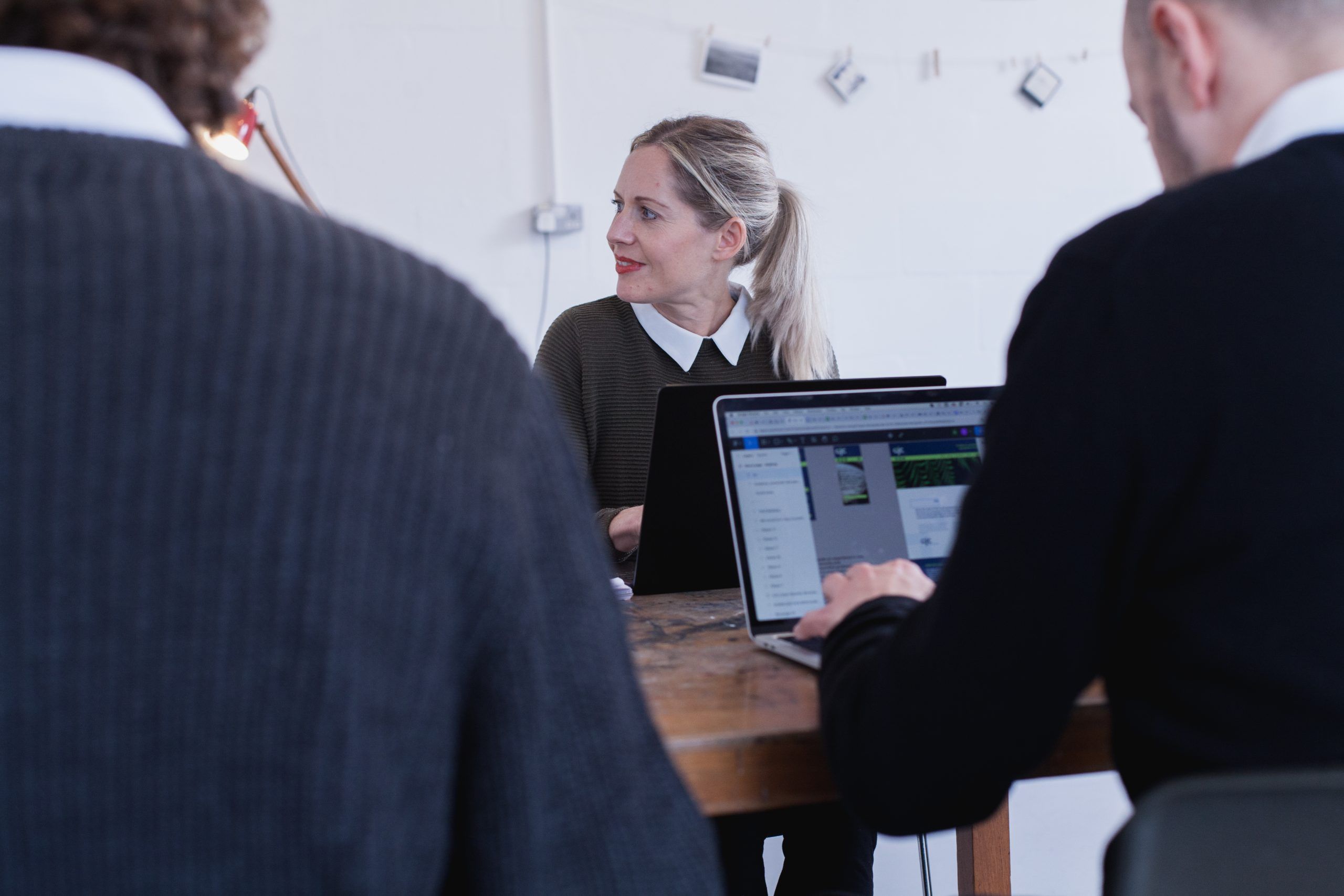 Woman at the office looking at the side and smiling