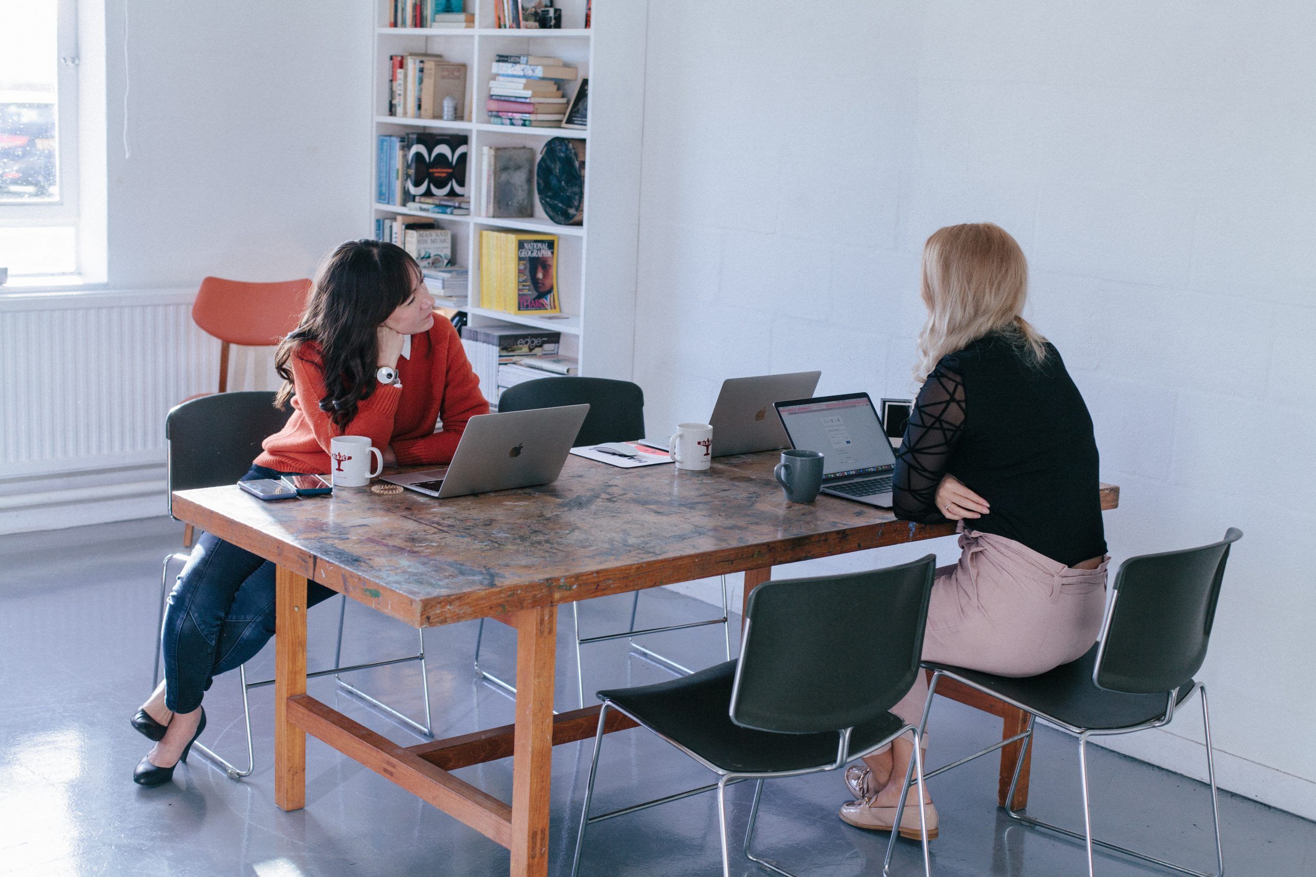 Two women having a discussion in the office
